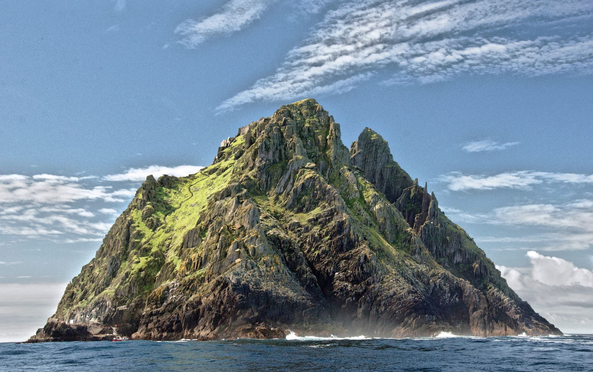 Vast, green mountainous island.